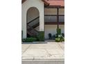 A charming condo features well-manicured landscaping and inviting stair access to the upper units at 6201 Country Club Dr # 21, Lake Wales, FL 33898