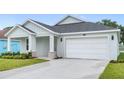 Inviting single-Gathering home with a two-car garage and a well-maintained lawn at 4545 Fairway Oaks Dr, Mulberry, FL 33860