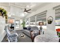 Sunroom with seating, dining area, and screened windows at 6734 Kensington Ne Dr, Winter Haven, FL 33881