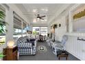 Bright sunroom with seating area and dining table at 6734 Kensington Ne Dr, Winter Haven, FL 33881