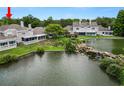 Stunning backyard view featuring a serene lake with rock waterfall and lush landscaping at 1144 Waterfall Ln # 26, Lakeland, FL 33803