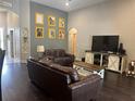 Cozy living room with gray walls, hardwood floors, and neutral decor, creating a welcoming atmosphere at 2875 Creeks Crossing Blvd, Lakeland, FL 33810