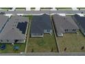 Backyard view of houses with fenced yards at 296 Spirit Landings Cir, Winter Haven, FL 33880