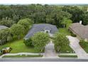 Housetop view showing a single-Gathering home with a large yard and driveway at 800 Osprey Landing Dr, Lakeland, FL 33813