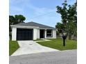 Charming home with a well-manicured lawn, front lawn, and inviting curb appeal at 1918 Dr Martin L King Jr Way, Haines City, FL 33844