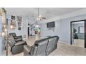 Living room displaying open floor plan, vaulted ceiling and tile floors at 834 Auburn Preserve Blvd, Auburndale, FL 33823