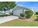Attached two-car garage offering ample space and convenience at 511 Alcazar Ct, The Villages, FL 32159