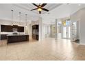 A light and bright, spacious living room and island kitchen with high ceilings and modern finishes at 5074 Shore Side Dr, Lakeland, FL 33812