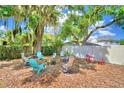 Relaxing backyard with fire pit and seating at 415 W Beacon Rd, Lakeland, FL 33803