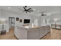 Open living room boasts wood floors, neutral tones, and abundant natural light at 570 Gandhi Dr, Lakeland, FL 33813