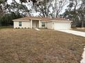 Newly built home with brown roof and large yard at 1271 Groveland Ln, Lakeland, FL 33811