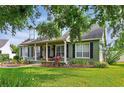 Beautiful home with black shutters, complemented by well-maintained landscaping and lush green lawn at 1935 Austin Ter, Winter Haven, FL 33884