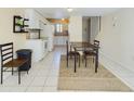 Bright dining area with tiled floor and views of the open kitchen at 1836 N Crystal Lake Dr # 46, Lakeland, FL 33801