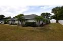 Lush lawn surrounds this house, complete with a convenient storage shed at 2556 Roslyn Ln, Lakeland, FL 33812