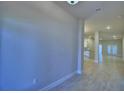 Bright and spacious living area with neutral paint, recessed lighting, and tile flooring at 4639 Grandview Glen Dr, Auburndale, FL 33823
