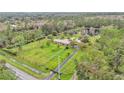 Expansive property featuring a beautiful home, pond, large lot, and private wooded setting at 9240 Moore Rd, Lakeland, FL 33809