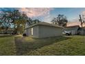 Rear view of a newly built home showcasing its clean lines and landscaping at 110 5Th Sw St, Fort Meade, FL 33841