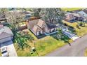 Charming single-story home featuring a well-manicured lawn and inviting curb appeal in a desirable neighborhood at 1555 Archers Path, Lakeland, FL 33809