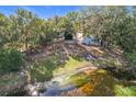 A view of the backyard and the tranquil pond, showcasing the property's peaceful setting at 309 W Frederick Ave, Dundee, FL 33838