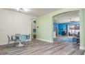 Bright dining area with light-colored floors and a table for four at 185 St Thomas Dr, Mulberry, FL 33860
