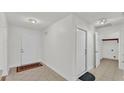 Bright and airy entryway with tile flooring and access to laundry at 3107 Valley High Dr, Lakeland, FL 33813