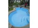 A clean, bright blue swimming pool with surrounding patio, ready for outdoor relaxation and entertainment at 5635 Canvasback Ct, Lakeland, FL 33805