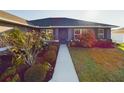 Charming single-story home with well-maintained landscaping and a cozy front entrance at 1155 Towergate Cir, Lake Wales, FL 33853