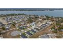 Aerial view showing home's location near a lake in a residential neighborhood at 1225 Third Ct, Eagle Lake, FL 33839