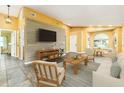 Bright living room with wood accent wall and tile flooring at 4617 S Devon Ave, Lakeland, FL 33813