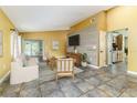 Comfortable living area features neutral furnishings and seamless access to the kitchen and outdoor patio at 4617 S Devon Ave, Lakeland, FL 33813