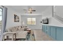 Living room with sectional sofa and Mickey Mouse art at 531 Las Fuentes Dr, Kissimmee, FL 34746