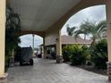 Covered entryway featuring stone accents and mature landscaping at 535 Narrow Pond Rd, Polk City, FL 33868