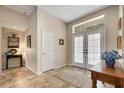 Inviting entryway with tile flooring and neutral tones at 5933 Lake Victoria Dr, Lakeland, FL 33813
