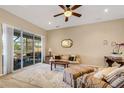 Relaxing living room with plush seating and access to patio at 5933 Lake Victoria Dr, Lakeland, FL 33813