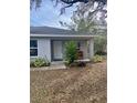 Front view of a cozy gray house with a covered porch at 520 Green Cir, Fort Meade, FL 33841