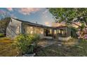 Home's backyard features a patio and screened enclosure at 6069 Kittiwake Dr, Lakeland, FL 33809