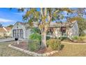 One-story house with a two-car garage and manicured landscaping at 6069 Kittiwake Dr, Lakeland, FL 33809