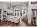 Spacious Gathering room featuring hardwood floors, a large window, and comfortable seating at 111 Arbor Way, Auburndale, FL 33823