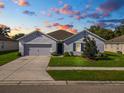 Attractive single-story home with a well-maintained front lawn and inviting curb appeal at 1655 Laurel Oaks Dr, Bartow, FL 33830