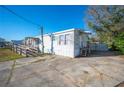 Single-wide manufactured home with ramp access at 4307 Meadow Ridge Ct, Mulberry, FL 33860