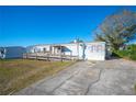 Single-wide manufactured home with ramp access at 4307 Meadow Ridge Ct, Mulberry, FL 33860