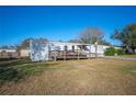 Single-wide manufactured home with ramp access at 4307 Meadow Ridge Ct, Mulberry, FL 33860