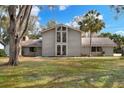 Two-story house with a large yard and palm trees at 1118 Cypress W Pt, Winter Haven, FL 33884