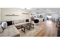 Spacious living room featuring a sectional sofa and modern coffee table at 2226 Cordova N Cir, Lakeland, FL 33801