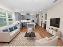 Open living area with hardwood floors and access to kitchen at 234 Laynewade Rd, Polk City, FL 33868