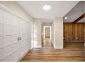 Bright entryway with white double doors and wood flooring at 410 N Tecumseh Ave, Fort Meade, FL 33841