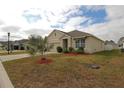 House with palm tree and well-kept lawn at 433 Montego Bay Dr, Mulberry, FL 33860