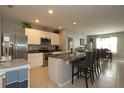 Island kitchen, stainless steel appliances, granite counters at 433 Montego Bay Dr, Mulberry, FL 33860