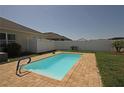 Private backyard pool with a brick patio and white privacy fence at 433 Montego Bay Dr, Mulberry, FL 33860