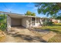 House exterior showcasing carport and landscaping at 514 Mohawk Ave, Lakeland, FL 33815